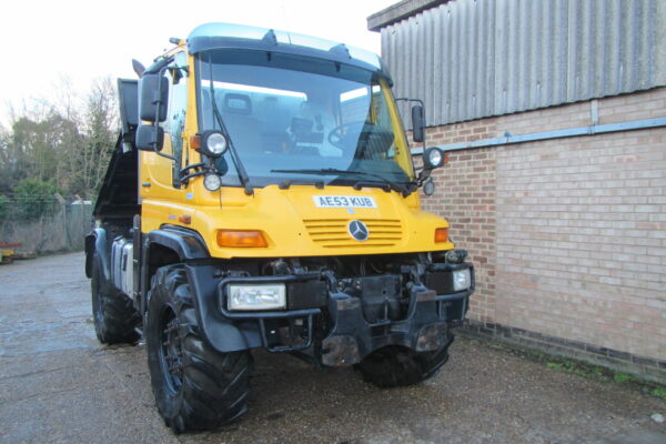 yellow mercedes-benz Unimog