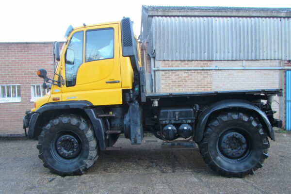 yellow mercedes-benz Unimog